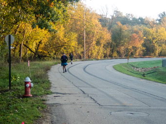 Runners on the road to the Mines of Spain area