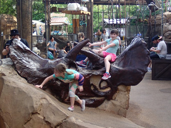 Jeralyn and Michelle on the skull at the Dinoland Playground