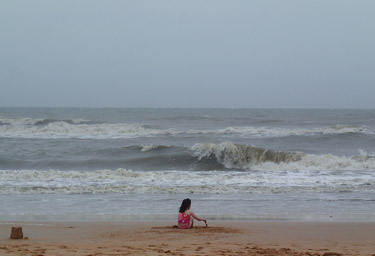 Jeralyn building sandcastles at Flagler Beach