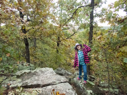 Trying to give daddy a heart attack. The rock cliff on the trail below our campsite.