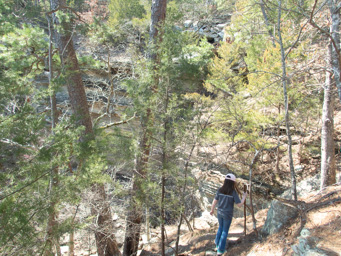 Climbing down to a waterfall.