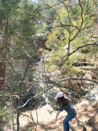 Jeralyn loses her hiking stick. The waterfall is in the background.